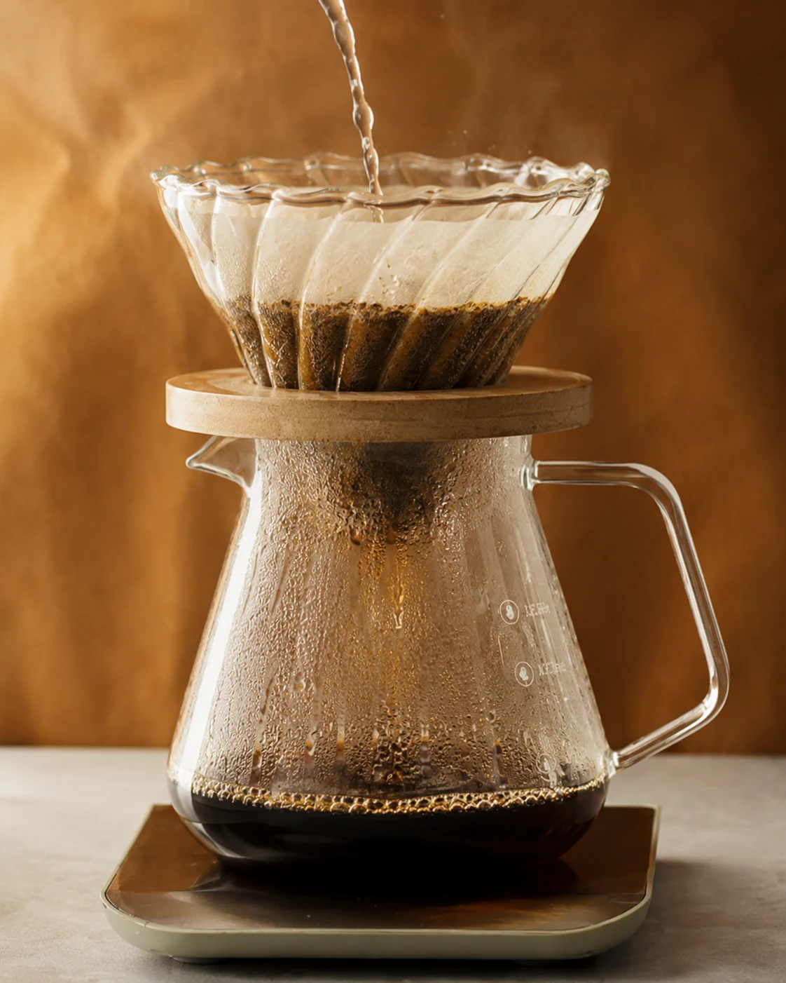 Glass pour-over dripper and coffee server used as the source image for the live brewing visualization